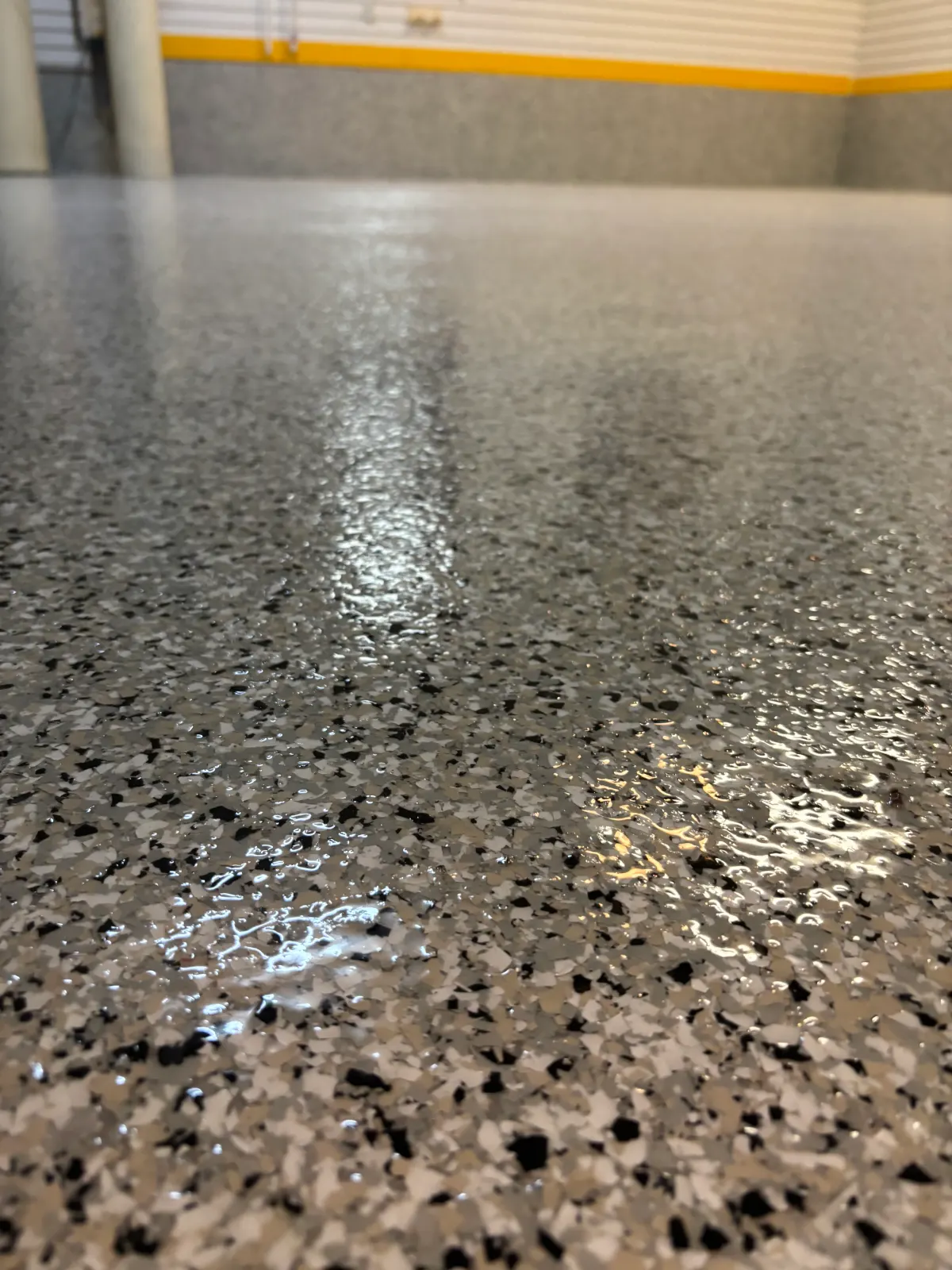 Gray and black flake epoxy floor close-up