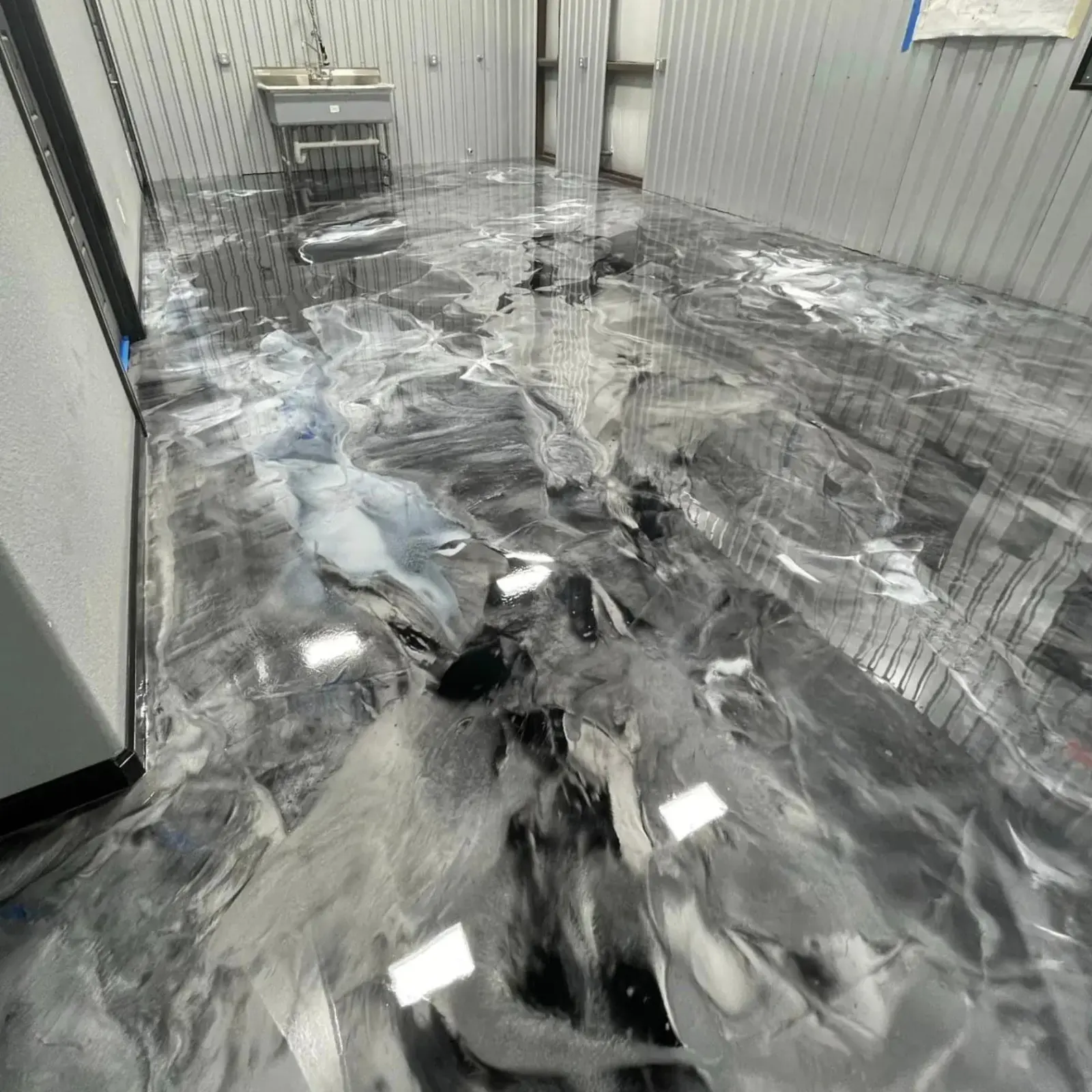 Gray metallic epoxy flooring in a commercial space